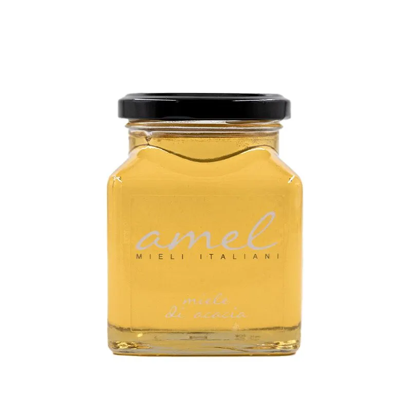 Miód akacjowy w szklanym słoiku